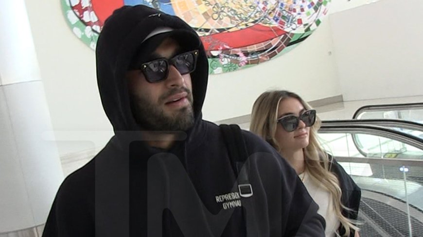 Sam Asghari Filmed With Britney Look-Alike Girlfriend at LAX Airport